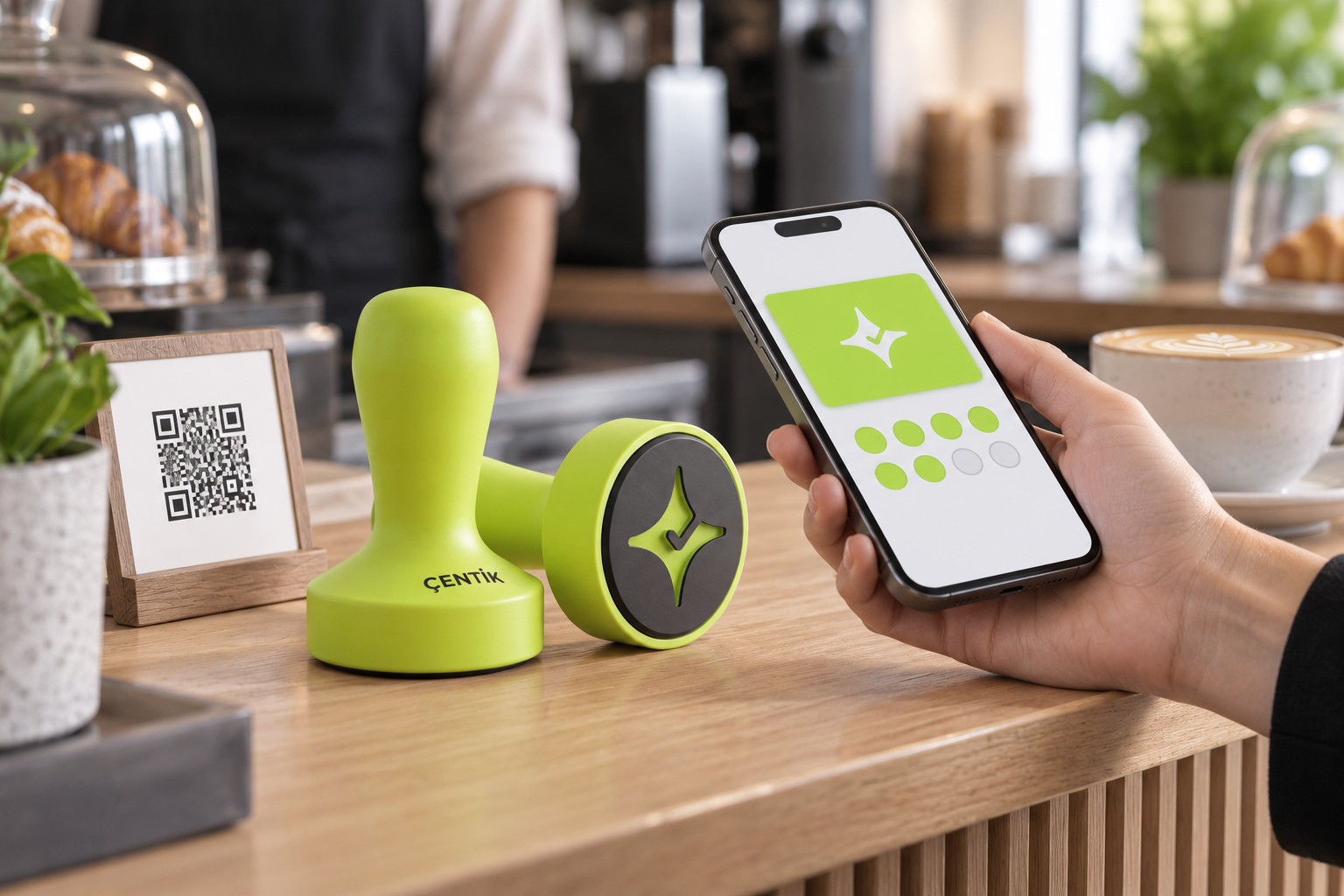 Çentik NFC counter touchpoint beside a phone using an app-free digital loyalty card